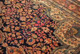 Peacock motif in the sand and jade spandrel of an antique Farahan Sarouk carpet.