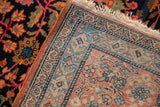 The fine, hand-knotted weave and original selvage on the reverse of an antique Farahan Sarouk carpet.