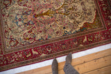 Antique Isfahan rug's pictorial border with deer and birds framing the intricate Tree of Life field.