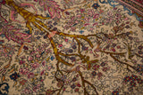 Detail of the mythological VakVak tree motif with animal-headed vines on a fine antique Isfahan rug.