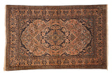 Antique Mohtashem Kashan rug with concentric medallions, a sandalwood field, and a deep navy blue ground.