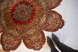 Inscribed border and worn trefoil contour of a collector's antique silk Tabriz rug.