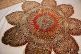 Detail of the delicate scalloped edge and inscribed border on a collectible 19th-century silk Tabriz.