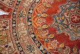 Close view of the frayed silk edge and inscription border of an antique Tabriz collector rug.