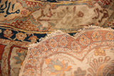 Tattered silk edge and worn foundation of a fine, collectible antique Persian Tabriz rug.