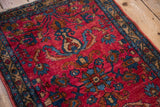 Angled close-up of a Lilihan rug's golden border, floral sprays, and textured low pile.