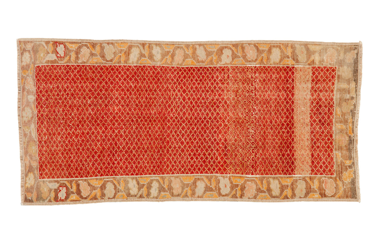 Vintage Oushak runner with a distressed cherry red lattice pattern and a faded ivory and saffron border.