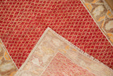 A folded corner reveals the hand-knotted foundation and secured side of the vintage Oushak rug.