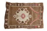 Distressed vintage Kars rug with a geometric medallion and prayer design in coffee brown, ivory, and raspberry.
