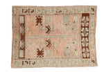 Vintage distressed Oushak rug featuring a Tree of Life design in pale rose, chocolate brown, and silver.