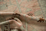 Even wear down to the knot heads on a softly folded vintage Turkish Oushak rug.