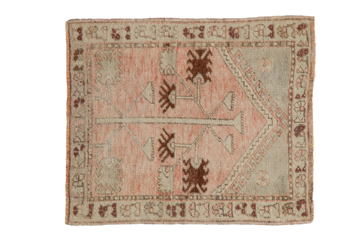 Distressed vintage Oushak square rug with tree of life motif in dusty blush and chestnut tones.