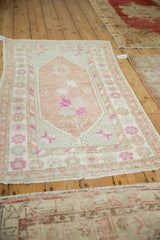 Decorative vintage Oushak rug with a soft, low pile and abrashed mauve tones.