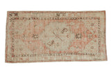 Distressed vintage Oushak runner, faded dusty rose and antique ivory geometric medallion, 2'5
