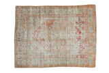 Distressed vintage Oushak rug featuring faded blush, rose, and sage floral designs, 3'2