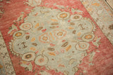Low pile texture and evenly worn knot heads on a distressed vintage Oushak rug.