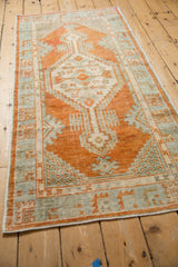 Angled view of the distressed Oushak runner showing its full length and design.