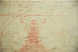 Patina and even wear across the knot heads of a distressed vintage Turkish Oushak rug.
