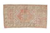 Distressed hand-knotted Oushak runner with faded blush medallion on an ivory field.