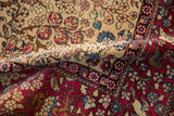 Ivory floral field and cochineal red pictorial border of a collector's antique Isfahan rug.