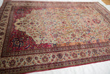 Qajar Kashan silk rug, finely delineated vines, colorful palmettes on jade green and cochineal red.