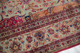 Finely delineated tendrils, colorful palmettes, and scrolling vines on the jade green field of an Antique Silk Kashan.