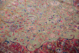 Finely detailed colorful palmettes and tendrils on rare jade green antique silk Kashan rug.