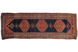 Antique Bijar rug runner, dark navy ground, triple stepped hexagonal medallions, madder red and teal.