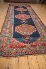 Antique Bijar rug's stepped hexagonal medallion with hook-and-latch motifs and madder red.