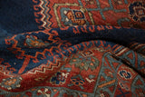 Antique Bijar rug pile featuring navy, madder red, and teal stepped geometric motifs.