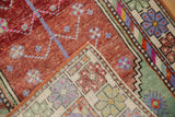 Hand-knotted foundation of the distressed Oushak rug showing colorful knots and muted pile.