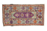 Vintage distressed Oushak runner with aubergine medallion, scrolled finials, and tangerine floral borders.