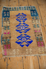 Evenly worn knot heads and intact side cord on the corner of a vintage Turkish Kars rug mat.