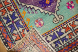 Hand-knotted foundation and textured low pile of a distressed vintage Oushak rug runner.