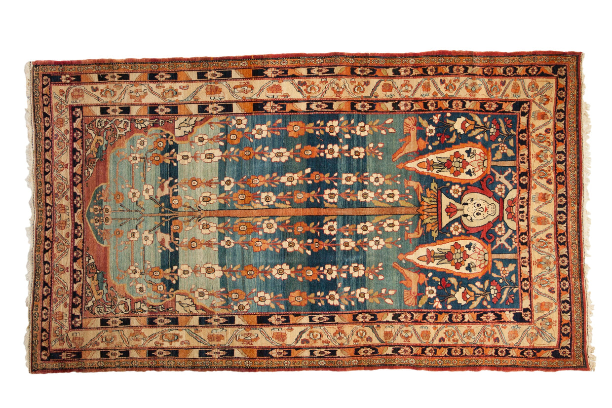 Rare Qajar period Kermanshah carpet with a masterfully woven Tree of Life composition.