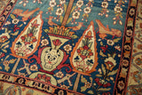 Surrealist devil face motif and dragon arabesques on an antique Persian Kermanshah carpet.