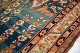 Detailed weave of a collector's Qajar Kermanshah rug with mythological figures on a naturally dyed blue field.