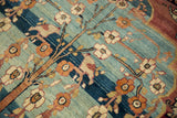 Bird and floral motifs from the Tree of Life on a fine Qajar Kermanshah carpet.