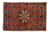 Antique Farahan Sarouk rug with a medallion, pictorial animals on a rust field, and a deep indigo border.