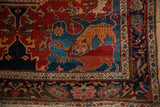 Detail of folkloric lion and deer figures in rich vegetable dyes on an antique Farahan Sarouk rug.