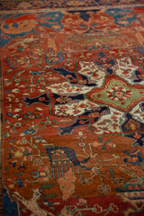 Angular vinery and stylized birds on the low-pile of a collectible late 19th-century Farahan Sarouk rug.