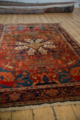 Low perspective on a collector's antique Farahan Sarouk, highlighting its rich color and folkloric motifs.
