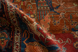 Textured pile of a folded antique Farahan Sarouk with rich madder red and indigo dyes.