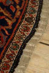 Mostly original side cord selvage framing the dense indigo border of a Persian collector rug.