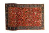 Antique Farahan Sarouk rug with a repeating forest scene of birds and vines in vivid red and sapphire blue.