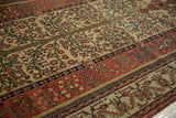 Angled view of the fine Fereghan carpet's floral bands and pomegranate minor border.