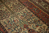 A view across the Tree of Life motif, showing the fine weave and color abrash of an antique Persian Fereghan rug.