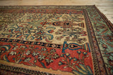Perspective view of a Fereghan carpet's tiered vase and Tree of Life design on an ivory field.