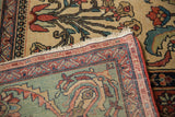 Antique Fereghan carpet corner with a detailed pomegranate minor border and wide, jade green floral band.