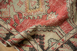The soft, pliable hand of the distressed Oushak runner highlights its low, even wear.